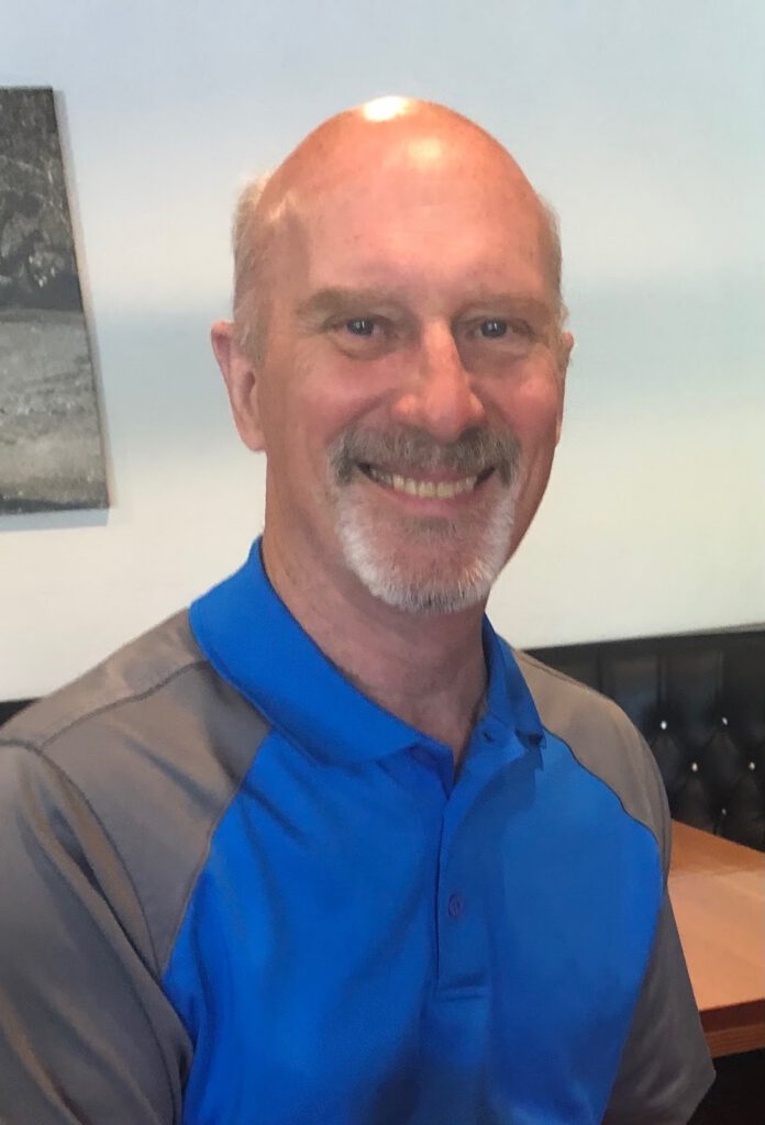 Smiling bald man with beard